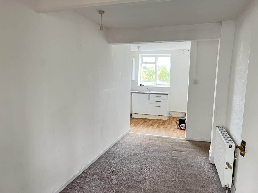 Lot: 145 - THREE-BEDROOM MAISONETTE FOR INVESTMENT OR OCCUPATION - Dining room looking into kitchen